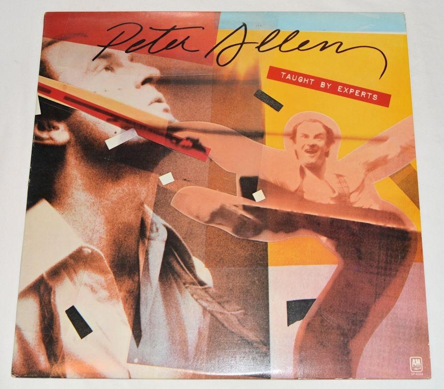 Used vinyl record of Peter Allen's album 'Taught By Experts' with a colorful cover featuring a portrait of the artist and silhouettes of hands.