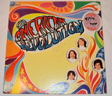 Used vinyl record album cover for 'American Revolution' by The American Revolution featuring colorful artwork with the band's name and faces.