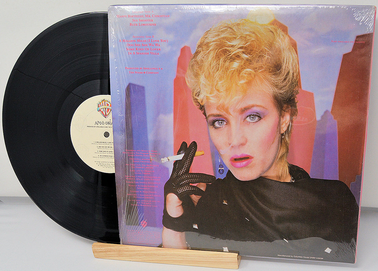 Vinyl record with a colorful cover featuring three women and the title 'Apollonia II'.