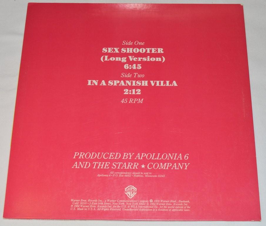 Used vinyl record cover for Apollonia 6 featuring three women in a colorful photo session with the title 'Sex Shooter' written in bold letters.
