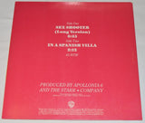 Used vinyl record cover for Apollonia 6 featuring three women in a colorful photo session with the title 'Sex Shooter' written in bold letters.