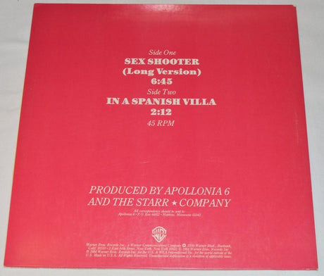 Used vinyl record cover for Apollonia 6 featuring three women in a colorful photo session with the title 'Sex Shooter' written in bold letters.