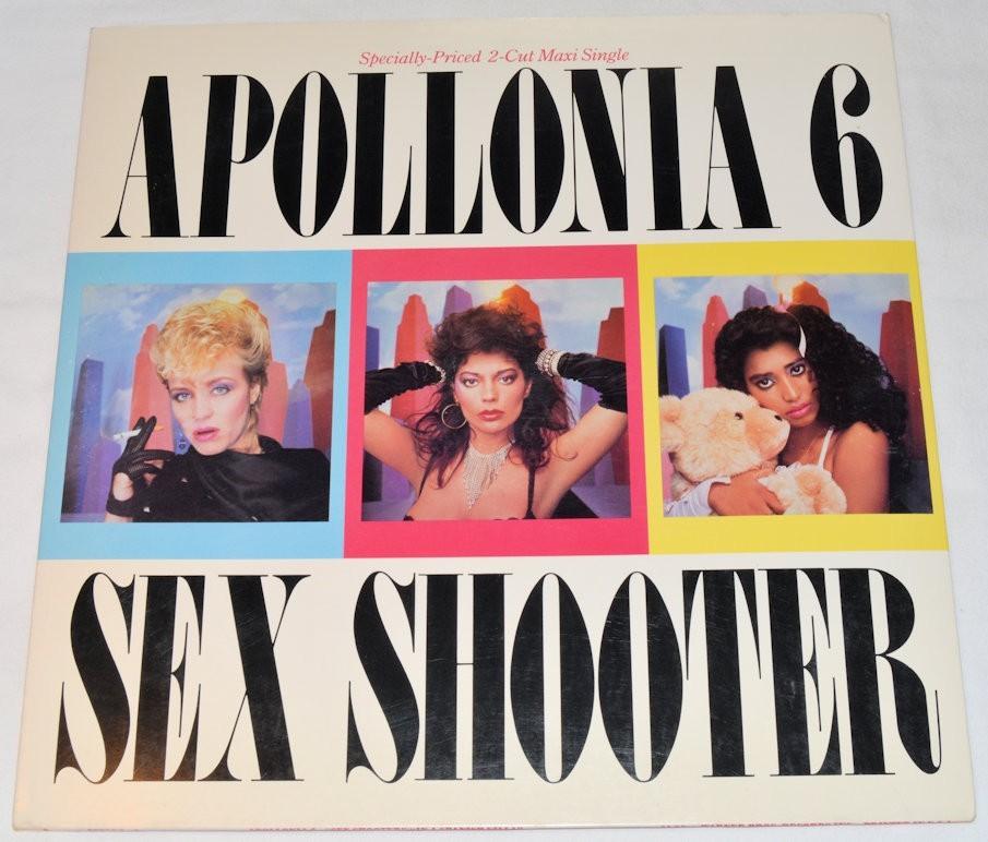 Used vinyl record cover for Apollonia 6 featuring three women in a colorful photo session with the title 'Sex Shooter' written in bold letters.