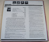 Vinyl record cover for Applejack featuring an image of a group of people playing musical instruments in front of a barrel, with the title 'Contra Dance Music New England Style' and the band name 'Applejack'.