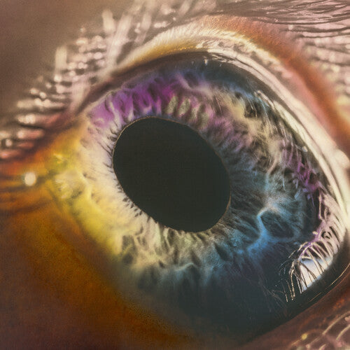 Close-up of an eye with vibrant colorful iris and surrounding tissues, resembling the cover art of the Arcade Fire album 'We'.