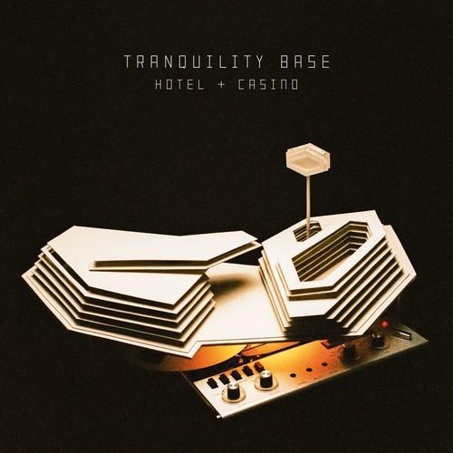 Cover art for Arctic Monkeys album 'Tranquility Base Hotel & Casino' depicting a stylized, minimalist design featuring a hotel and casino sign with a futuristic, geometric aesthetic.