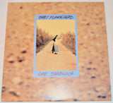 Used vinyl record titled 'Baby Flamehead - Life Sandwich' with a picture of a person walking down a road on the cover.