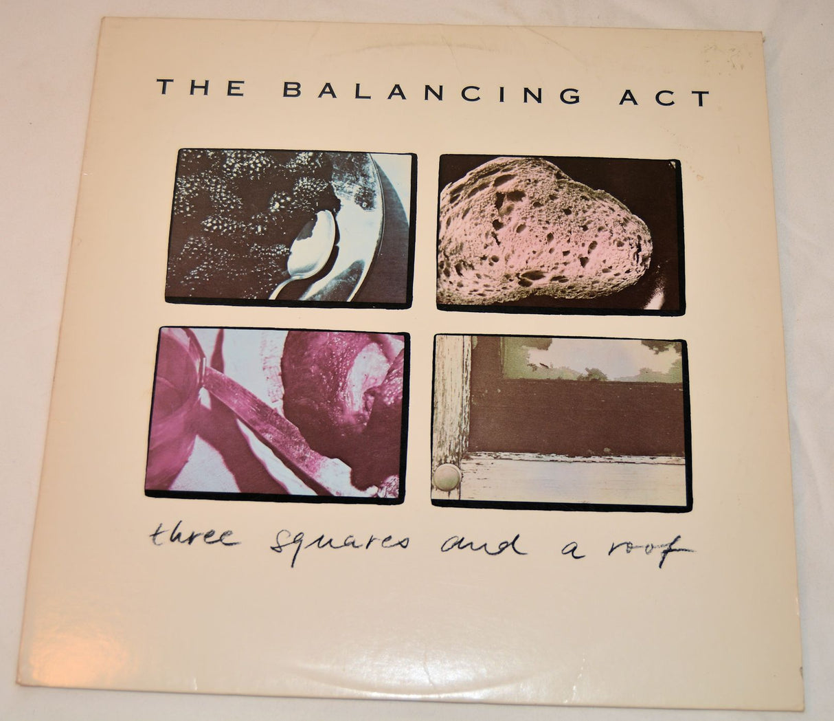 Balancing Act, The - Three Squares And A Roof
