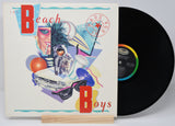 Beach Boys album 'Made in The USA' vinyl record with cover art featuring the band members, a convertible car, and the text 'Made in The USA'.