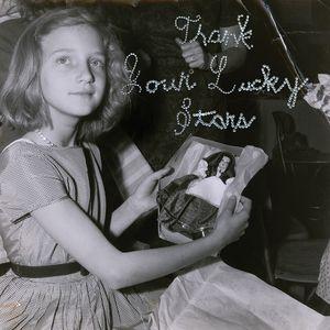 Beach House - Thank Your Lucky Stars Black and white photo of a young girl holding a vinyl record with the text 'Thank Your Lucky Stars' written above it.
