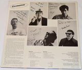 Back cover for the Beachmasters record showing pictures of each band member and text.