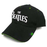 A black baseball cap with 'The Beatles' text in white and green detailing on the brim.