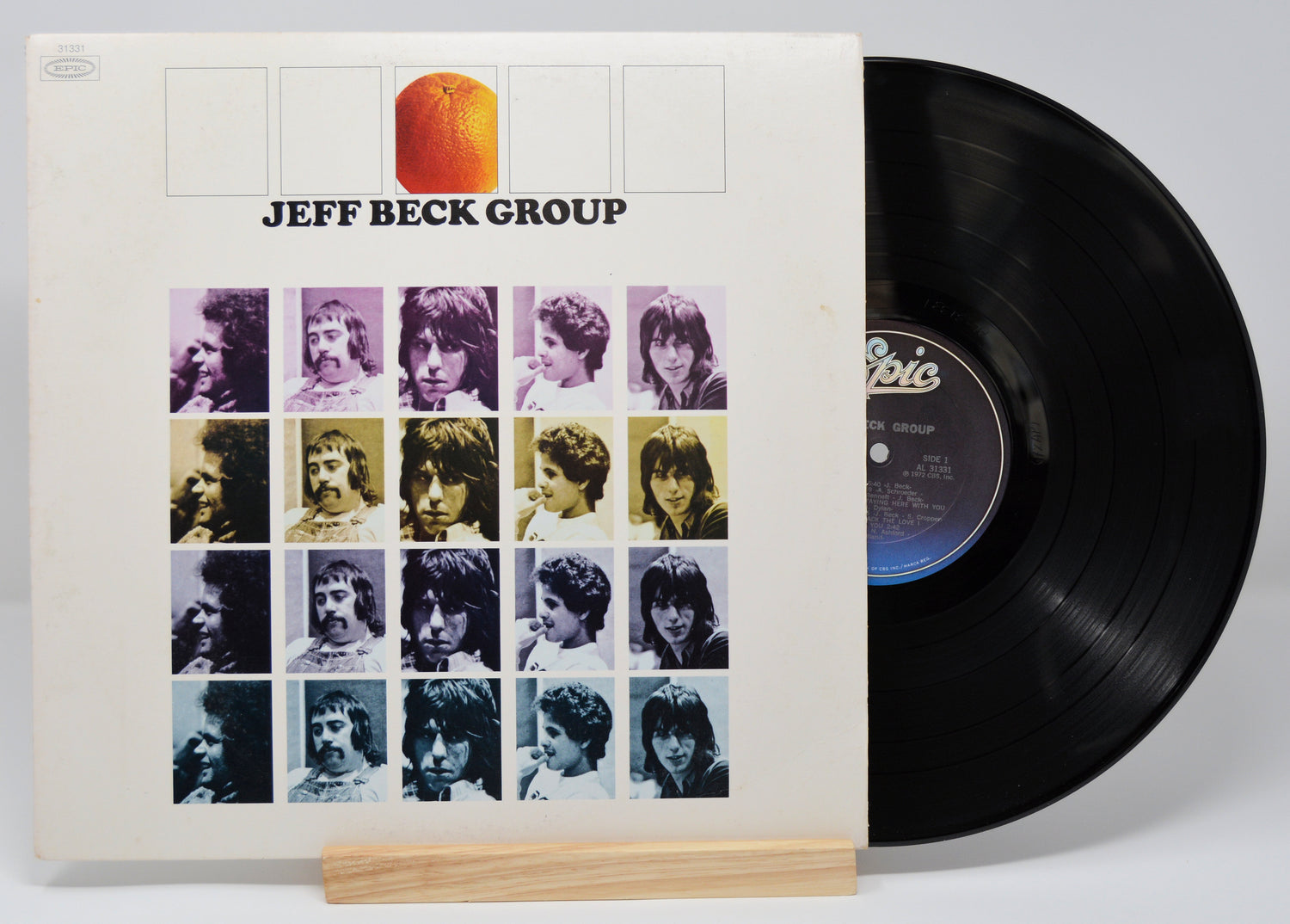A vinyl record titled 'Jeff Beck Group' with a colorful band photo on the cover.