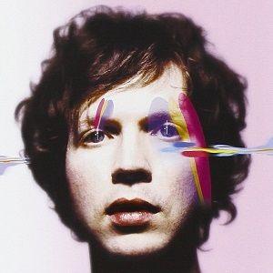Album cover art for Beck's Sea Change album featuring a close-up portrait of Beck with a colorful abstract design over his face.