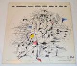 Vinyl record cover with a person sitting on a bench holding a green object, with 'Loredana Berté' text at the top.