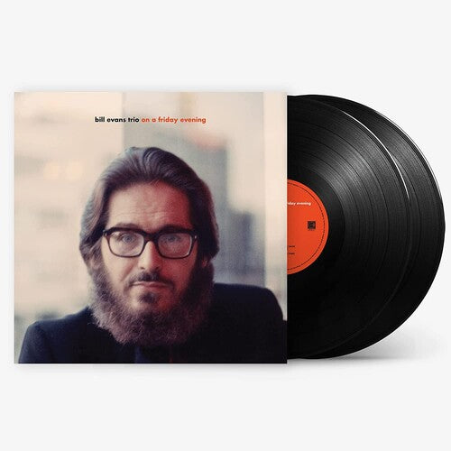 Vinyl record with cover featuring a portrait and album title 'On a Friday Evening' by Bill Evans Trio.