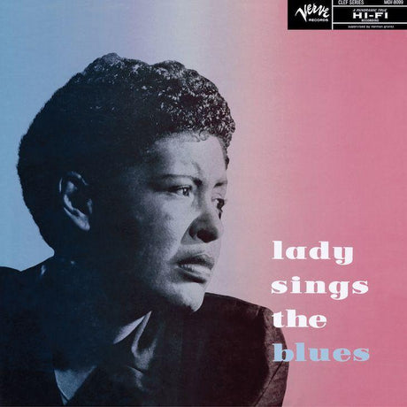 A vinyl record cover featuring a monochrome photograph of Billie Holiday with a pink and blue background, titled 'lady sings the blues'.
