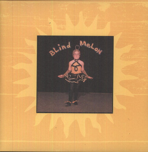 A vinyl record titled 'Blind Melon' with an image of a person performing or singing on the cover, set against a yellow background.