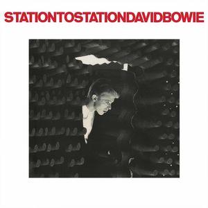 Cover art for David Bowie's album 'Station To Station' featuring a black and white image of David Bowie with a reflective, distorted background.