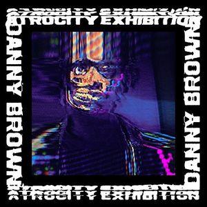 Album cover for Danny Brown's 'Atrocity Exhibition' featuring a digital artwork with Danny Brown's face in a colorful, abstract design.