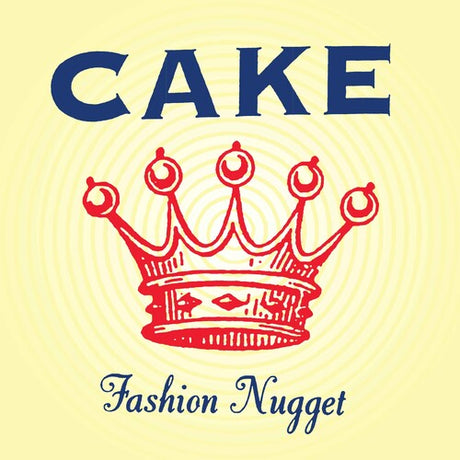 Record cover art featuring the band name Cake in bold letters at the top, with a red crown illustration below the text. The album title 'Fashion Nugget' is written at the bottom.
