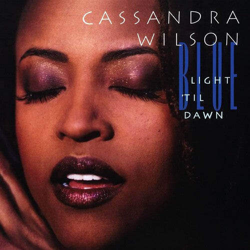 Album cover with a close-up of a person's face and text 'Cassandra Wilson Blue Light Til Dawn' on a dark background.