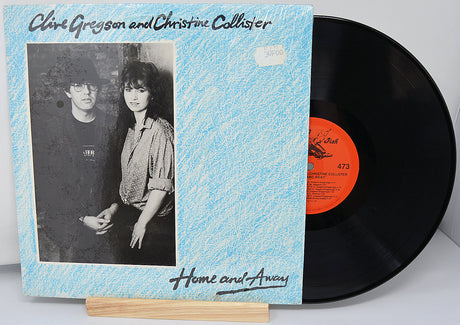 Vinyl record with cover featuring black and white photo of two people and text 'Home and Away'.