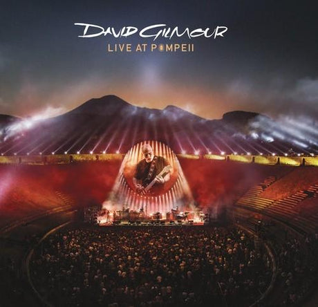 Album cover for 'Live at Pompeii' by David Gilmour with a stage and audience in front of a mountainous backdrop.