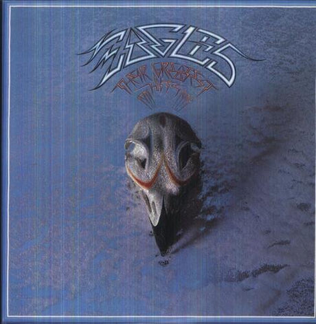 Eagles, The - Greatest Hits The cover art features an image of an eagle with a blurred background, indicating a focus on the eagle and the band name 'Eagles' at the top.