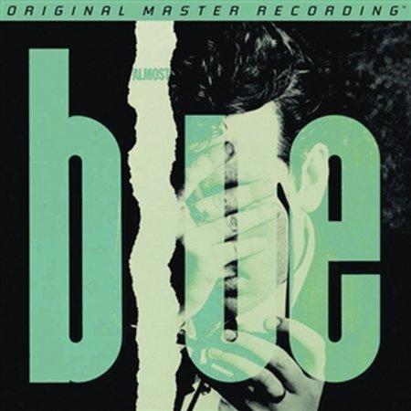 Album cover with text 'Almost Blue' and a person holding shoes.
