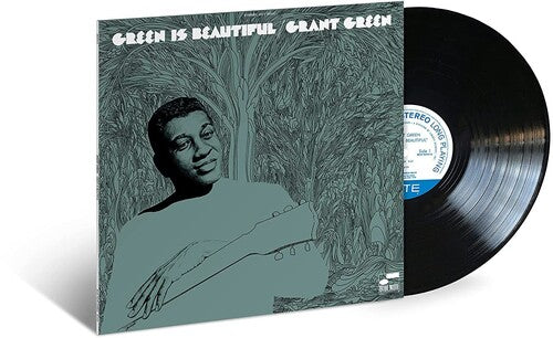 A vinyl record cover featuring a monochrome illustration of a person, with the title 'Green Is Beautiful' and the artist's name 'Grant Green' at the top.