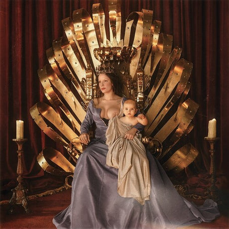 An album cover featuring Halsey seated on a golden throne, holding a child, with a red curtain backdrop.