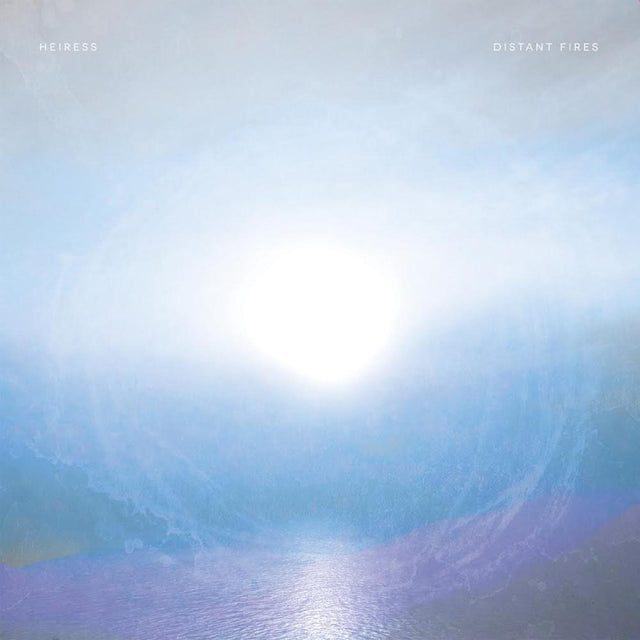 Vinyl record cover for Heiress - Distant Fires featuring a stylized image of a sun or another celestial body with a blue and purple hue.