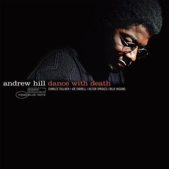 A vinyl record titled 'Dance With Death' by Andrew Hill, featuring a black and white photo of the artist with glasses on the cover.