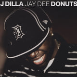 Album cover with a person wearing a cap and text 'J Dilla Jay Dee Donuts'