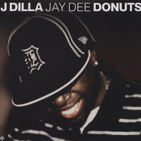 Album cover with a person wearing a cap and text 'J Dilla Jay Dee Donuts'