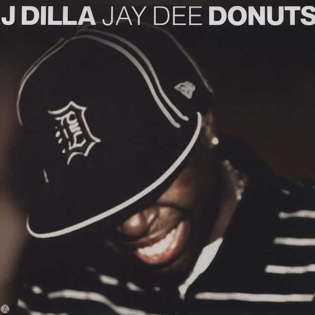 Album cover with a person wearing a cap and text 'J Dilla Jay Dee Donuts'