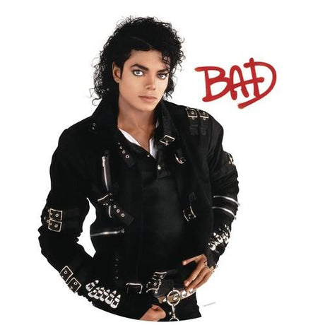 An album cover of Michael Jackson with the title 'BAD' displayed in red behind him. He is wearing a black jacket with silver accents and the image has a white background.