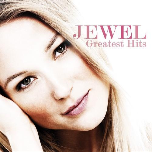 A vinyl record album cover featuring a photograph of Jewel, with the title 'Greatest Hits' printed above her image.