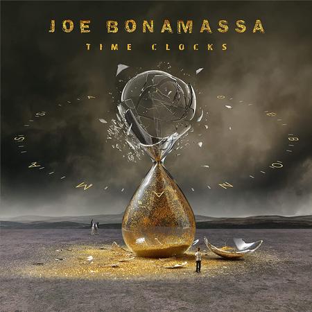 Album cover for Joe Bonamassa's 'Time Clocks' featuring a shattered hourglass in a desert landscape.