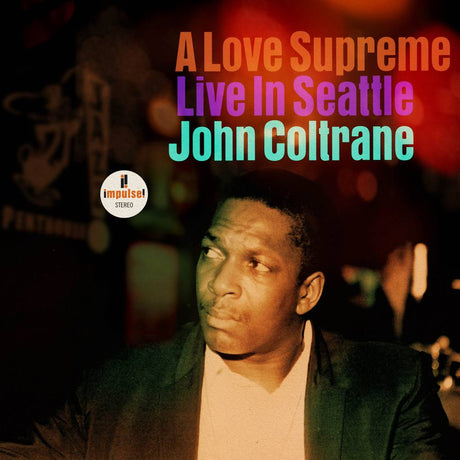 Album cover of 'A Love Supreme Live In Seattle' by John Coltrane with a blurred background.