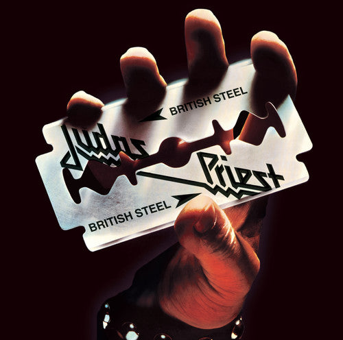 Razor blade with 'British Steel' and 'Aldus Parvus' branding held by a hand against a dark background.