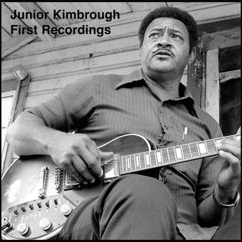 Black and white photo of a man playing guitar with text 'Junior Kimbrough First Recordings'.