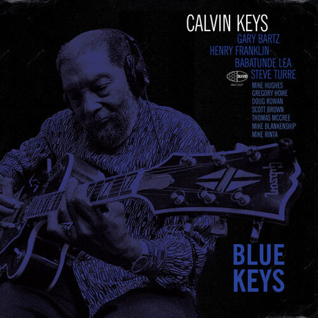 Cover art for Calvin Keys album 'Blue Keys' featuring a black and white image of a man with headphones playing an electric guitar, against a blue background.