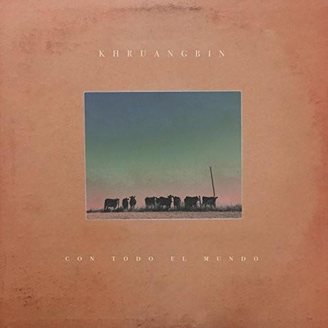  Vinyl record album cover for Khruangbin's album Con Todo El Mundo, featuring a desert landscape with silhouetted figures and a setting sun.
