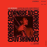 Album cover of 'Cornbread' by Lee Morgan featuring a jazz musician with a trumpet on an orange background.