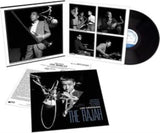 Vinyl record with cover featuring jazz musicians and text 'Lee Morgan The Rajah' on a white background.