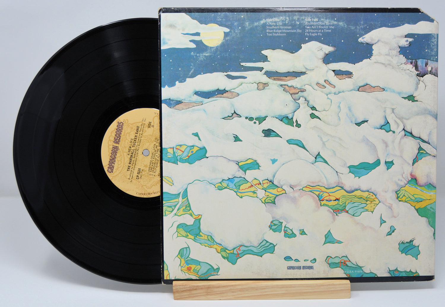 Vinyl record by Marshall Tucker Band titled A New Life showing the album and back cover.