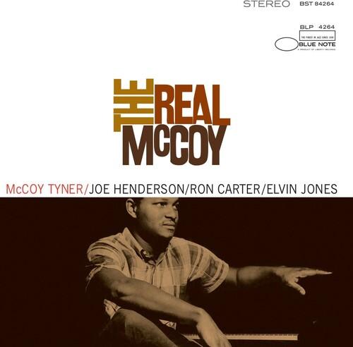 Album cover of 'The Real McCoy' featuring a person sitting with a piano, with text indicating musicians involved.