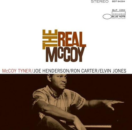 Album cover of 'The Real McCoy' featuring a person sitting with a piano, with text indicating musicians involved.